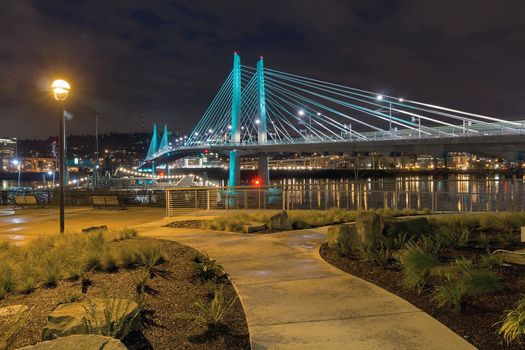 Tilikum Crossing Bridge Over Willamette River by the Waterfront Walkway in Portland Oregon at Night