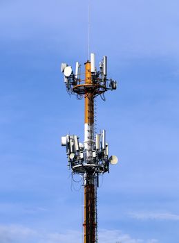 Cellular telecommunication tower under blue sky