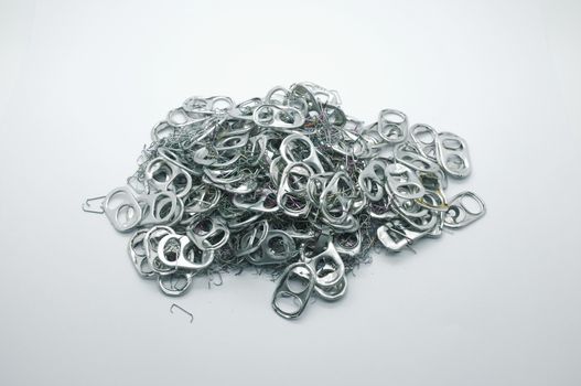 pile of many Metal pull ring of can and used staple needle