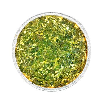 Celtic cake with spinach, tomatoes, oatmeal and eggs in baking dish foil isolated on white background on top
