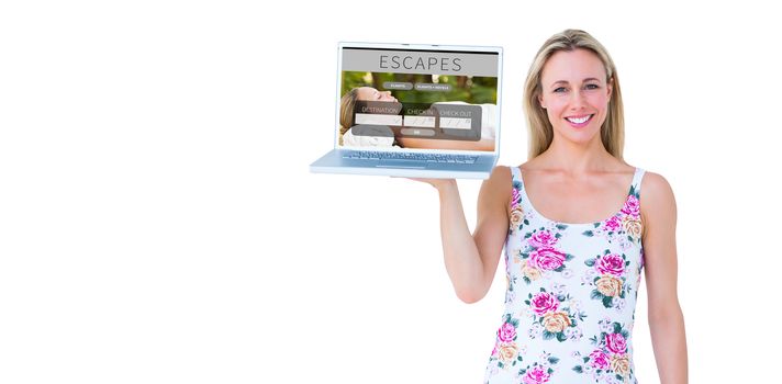 Smiling blonde holding laptop and posing against holidays booking app