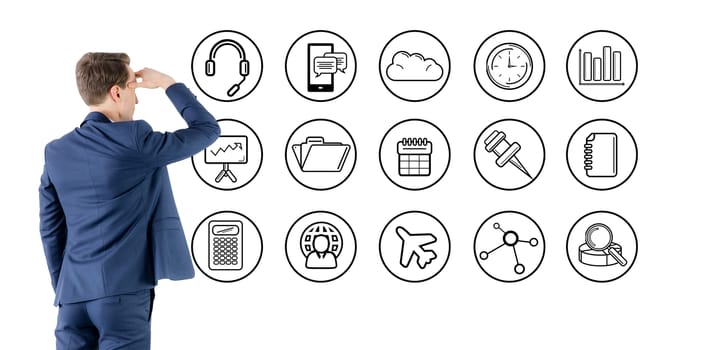 Wear view of businessman looking away  against telephone apps icons 