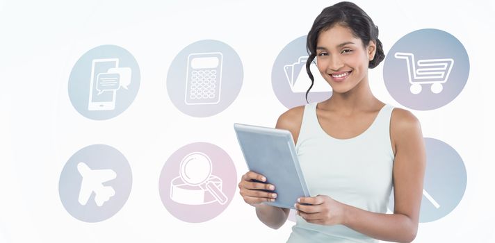 Portrait of smiling businesswoman using tablet computer against telephone apps icons 