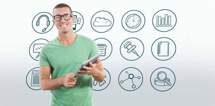 Smiling man wearing glasses while holding digital tablet against telephone apps icons 