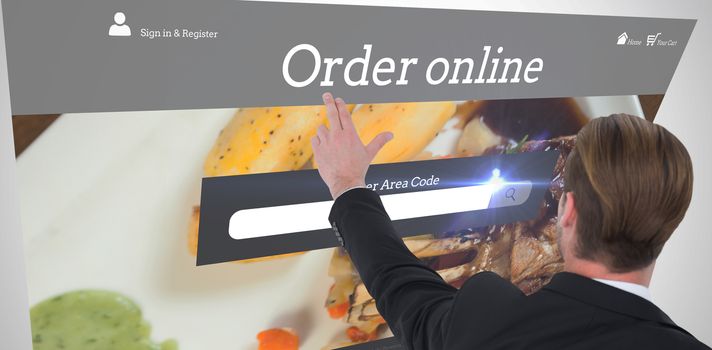 Rear view of businessman pointing with his fingers against food app