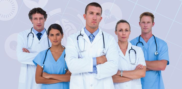 Portrait of serious doctors standing with arms crossed  against pastel blue