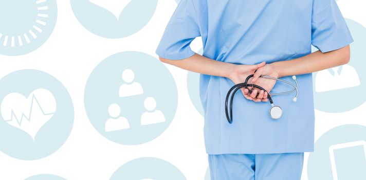 Rear view of female surgeon holding stethoscope against medical app