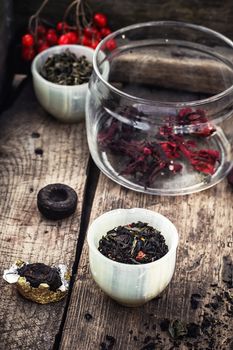 Tea leaves of different varieties in the stacks of custard