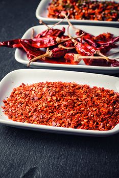 Assembly seasoning of pepper and hot spices in a porcelain bowl