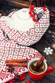 White custard glass teapot with warm scarf in country style