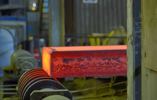 hot steel on conveyor in steel mill