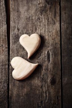 Wooden hearts handmade holiday Valentine's Day on a vintage wooden background