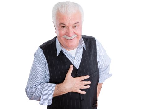 Isolated single mature man with smile and respectful expression gesturing as hand is on chest