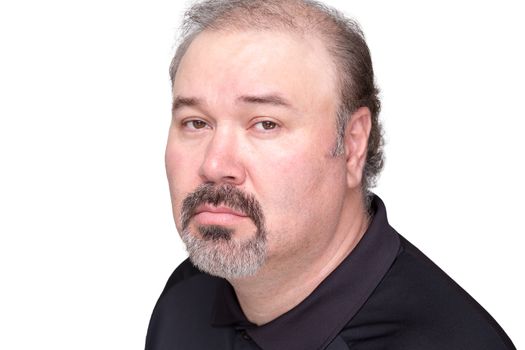 Close up of downcast middle aged male in black shirt with graying beard and mustache over white background
