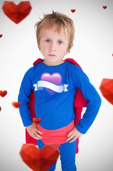 heart with scroll against portrait of boy dressed as superhero