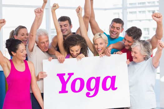The word yoga and excited people holding blank billboard at gym against white wave design