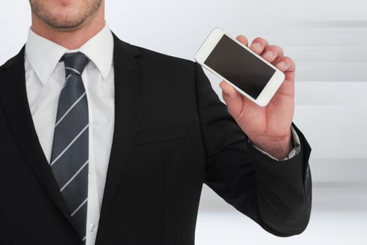 Businessman showing his smartphone screen against abstract white design