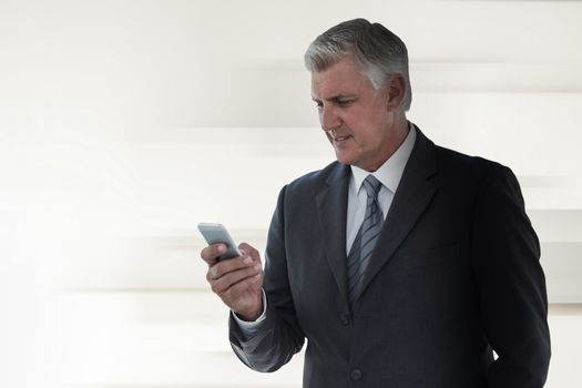 Businessman using his smartphone against abstract white design
