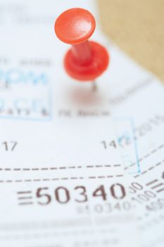 Cash register with pushpin. Close-up photo