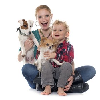 little boy, dogs and mother in front of white background