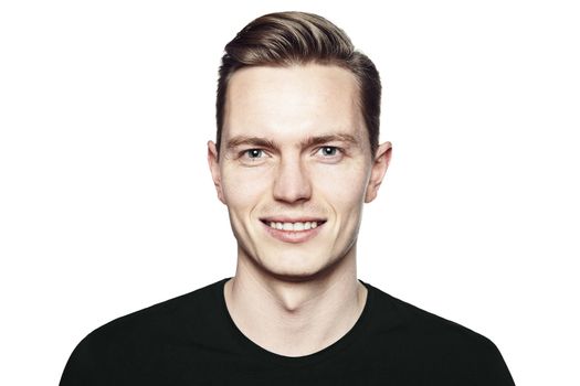 Studio shot of young man smiling to camera. Isolated on white background. Horizontal format, he is looking to the camera, he is wearing a black T-shirt.
