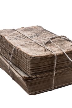 two worn-out old books tied with string on an isolated background