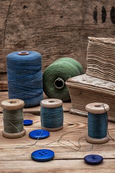 spool sewing thread and buttons in vintage style