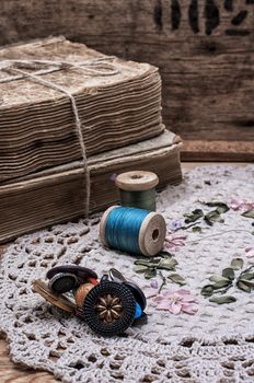 spool sewing thread and buttons in vintage style