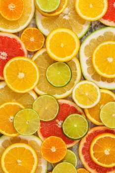 Background from citrus fruits: orangse and lemons and lime. 