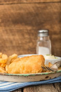 Battered deep fried fish photographed closeup.