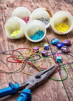 thread,beads and tools for needlework vintage background