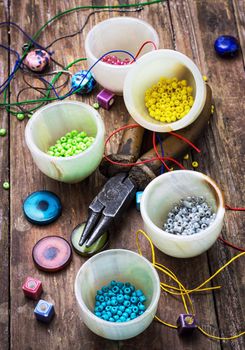 thread,beads and tools for needlework vintage background