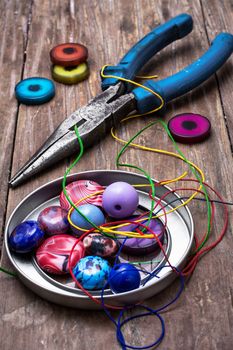 thread,beads and tools for needlework vintage background