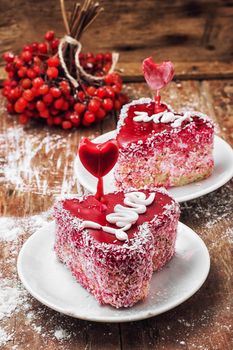 cake in the shape of heart with the inscription love and bunch of berries of viburnum