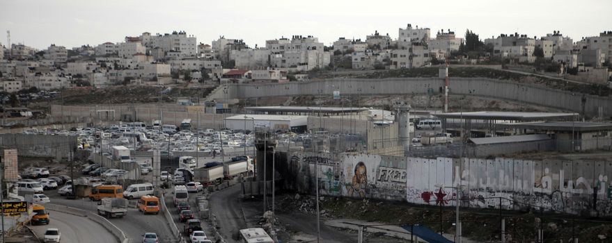 WEST BANK, Ramallah: A general view of Qalandiya refugee camp near the West Bank city of Ramallah, on December 16, 2015. Two Palestinians were killed overnight in separate attempts to ram their cars into Israeli soldiers carrying out arrests at a refugee camp near Ramallah, Israeli and Palestinian sources said.
