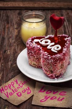 cake with fruit filling in the shape of heart with the inscription love