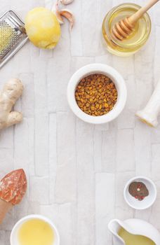 Homemade ginger turmeric tea, ingredients. Top view, blank space, vintage toned image. Natural light