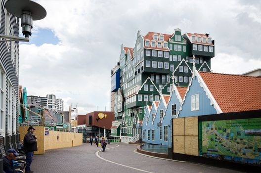 Zaandam, Netherlands - May 5, 2015: People walk on a pedestrian zone in Zaandam, Netherlands. Zaandam was a leading city in the first Industrial Revolution. Into the second half of the 20th century, Zaandam was still an important lumber port.