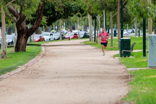 MELBOURNEAUSTRALIA - FEBRUARY 2: Lunchtime jogger running the iconic 'Tan' track in Melbourne.