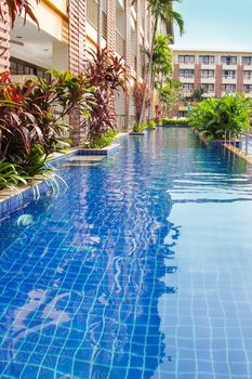 Bright photo with closeup of  poolside relax zone in Thailand
