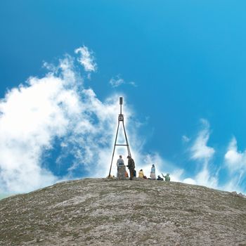 Group of hikers on the top of the hill.