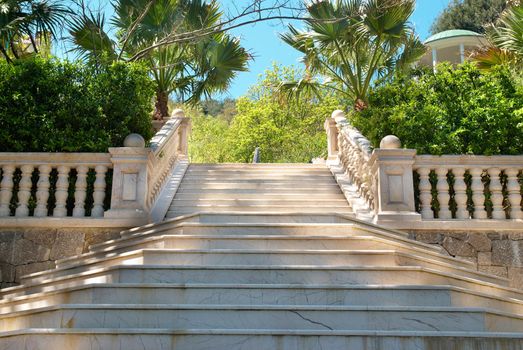 Marble stairs in the green tropical park