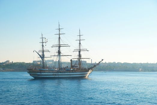 Beautiful sailing vessel in the sea comes into bay