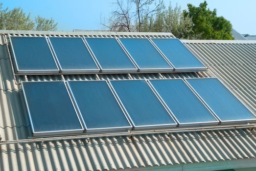 Solar water heating system on the red roof. Gelio panels.