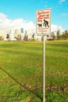 Sign clean up after your dog. Green park. Vancouver, Canada