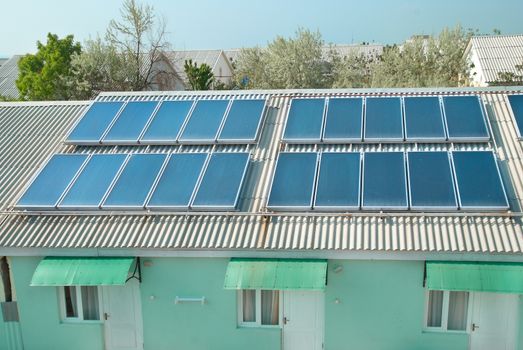 Solar water heating system on the red roof. Gelio panels.