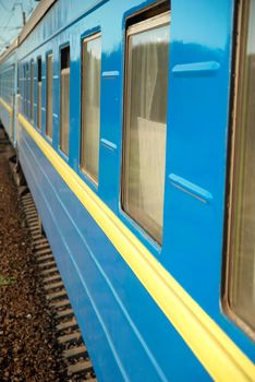 Motion train and blue wagon. Urban transportation