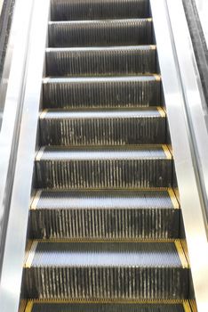 Empty escalator steps on staircase in the airport