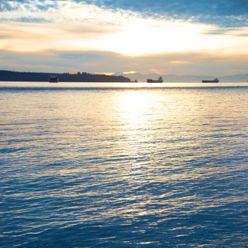 Sunset on the sea. Coastline and beautiful cloudscape.