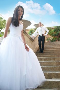 Beautiful wedding couple- bride and groom on the stairs. Just married